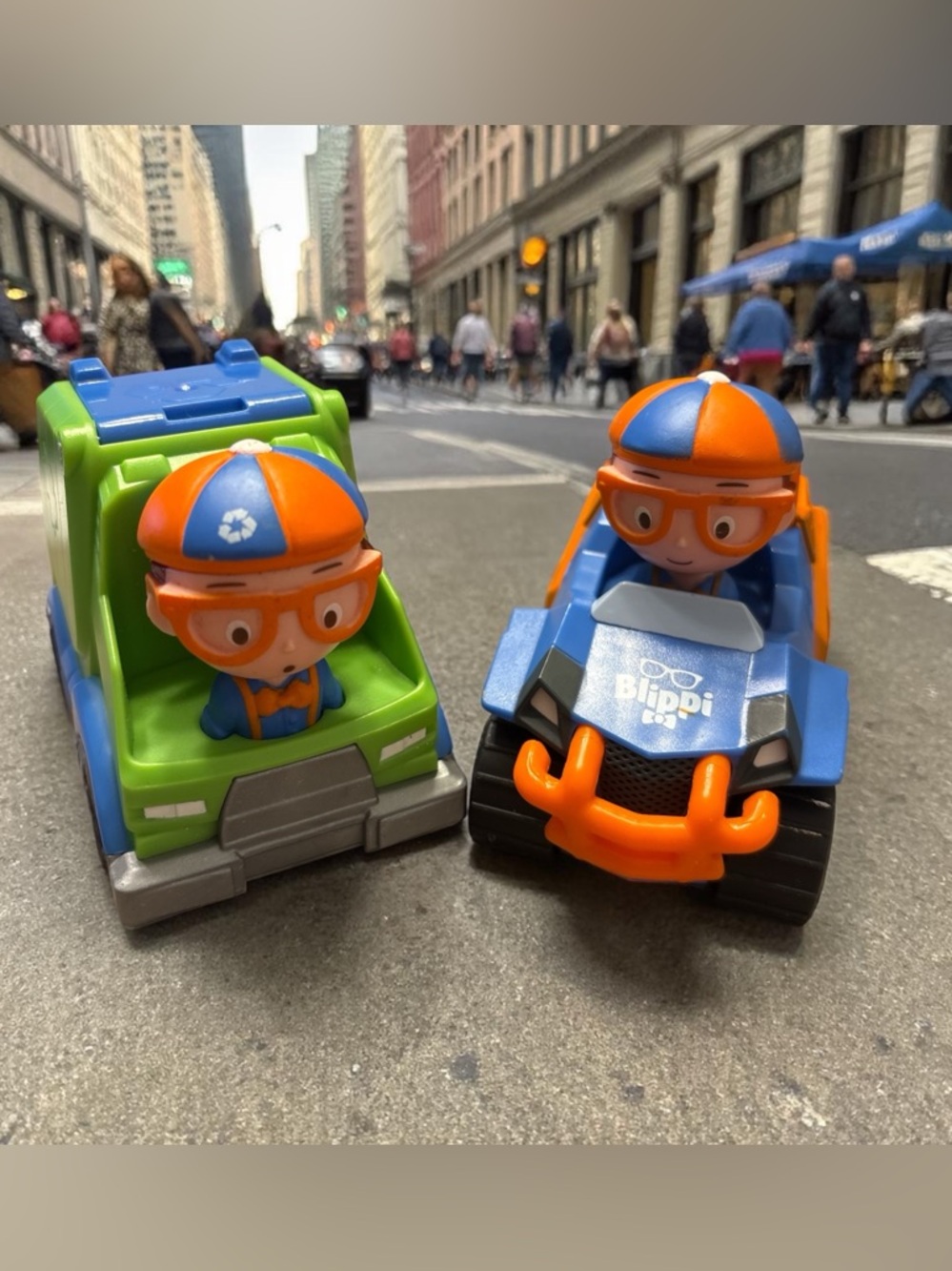 Blippi Mini Vehicles 2-Pack, featuring the Blippi Mobile and a Garbage Truck.